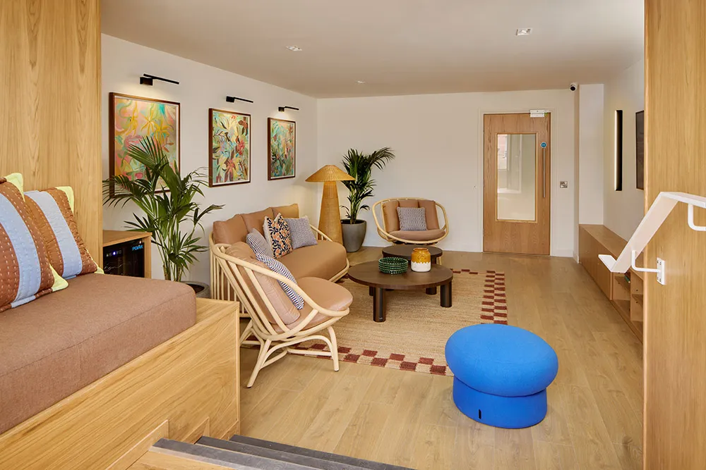 Sun lounge room with comfortable seating and steps up into roof terrace at PLATFORM_ in Edinburgh